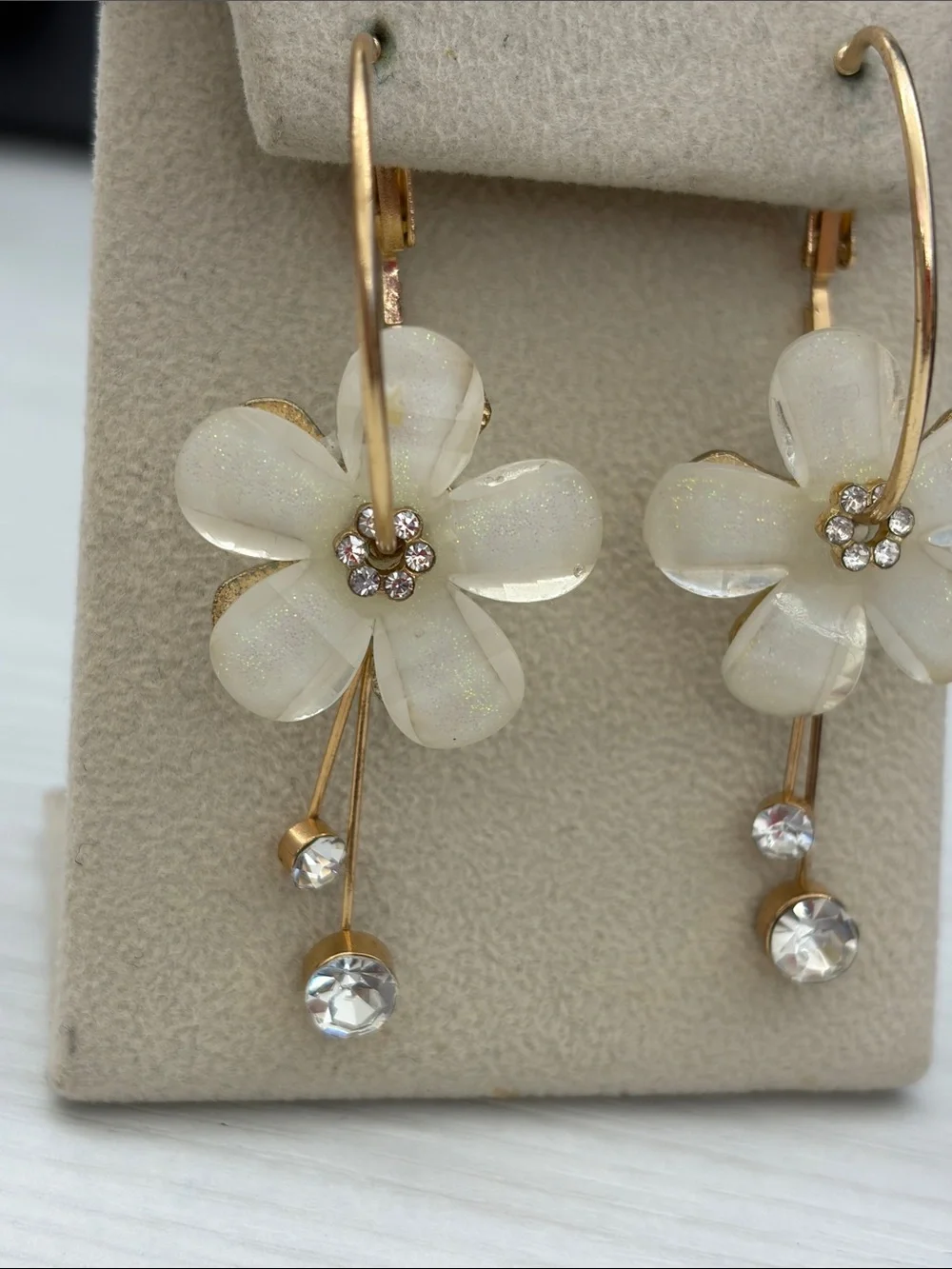 Gold Hoop Earrings with White Flower Drops and Crystal Accents